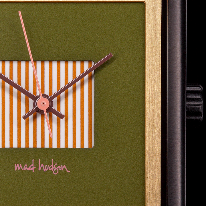 close up Square watch with green face  on a black background. Black stainless steel square case Layered design with a gold frame. mauve and pink hands gold stripped center dial Engraved case back. Adjustable Strap. The Marshall Watch Mad Hudson Watches