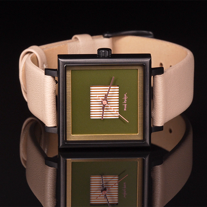 Square watch with green face and beige strap on a black background. Black stainless steel square case, beige leather band. Layered design with a gold frame. Engraved case back. Adjustable Strap. The Marshall Watch Mad Hudson Watches